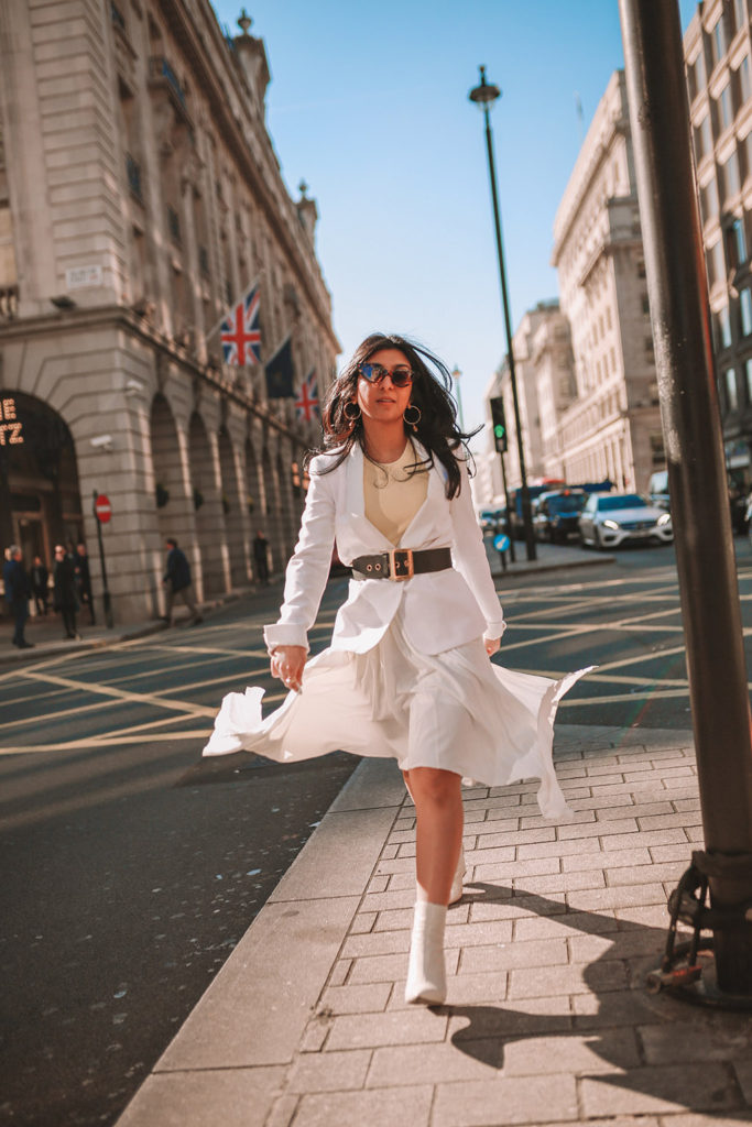 Luxury fashion blogger Shloka Narang of The Silk Sneaker shares her take on how to wear an elegant all white outfit for a chic spring look featuring Dior
