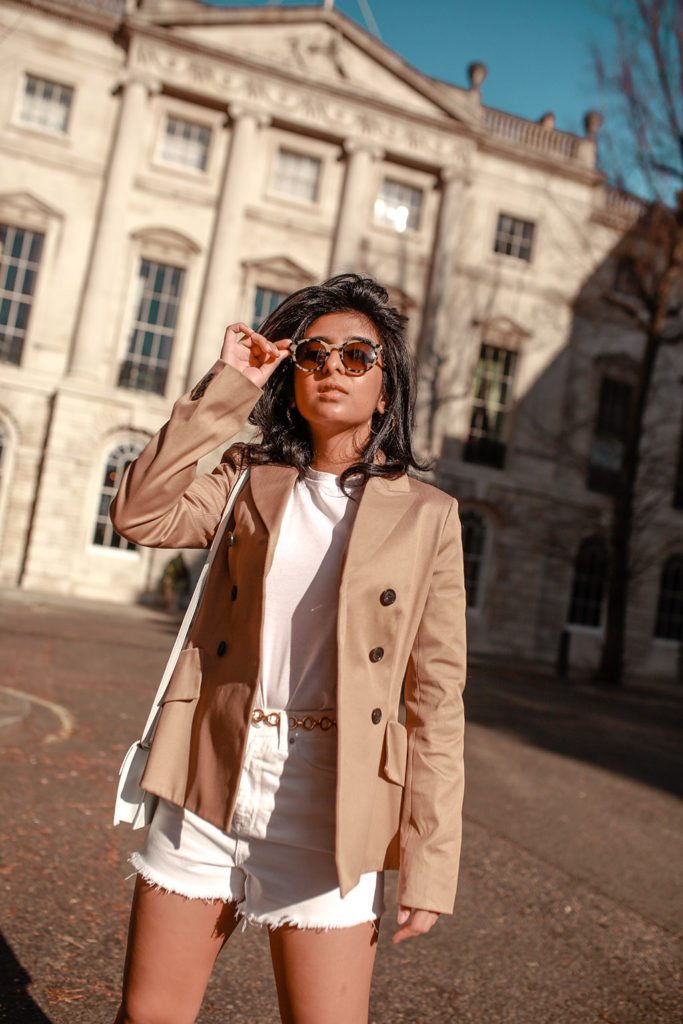 Luxury fashion blogger Shloka Narang of The Silk Sneaker shares how to style white denim shorts for a cute summer outfit featuring Topshop, & Other Stories and Dior