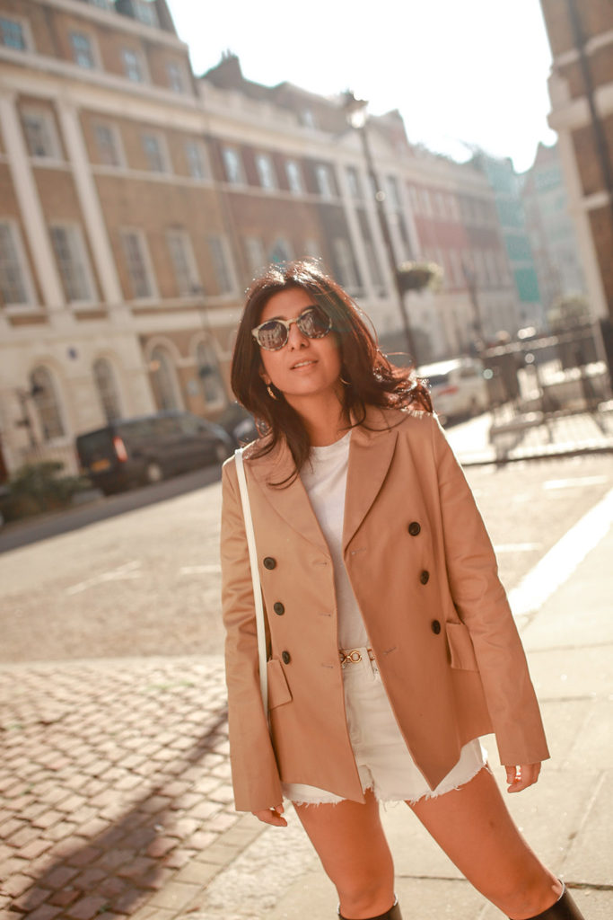 Luxury fashion blogger Shloka Narang of The Silk Sneaker shares how to style white denim shorts for a cute summer outfit featuring Topshop, & Other Stories and Dior