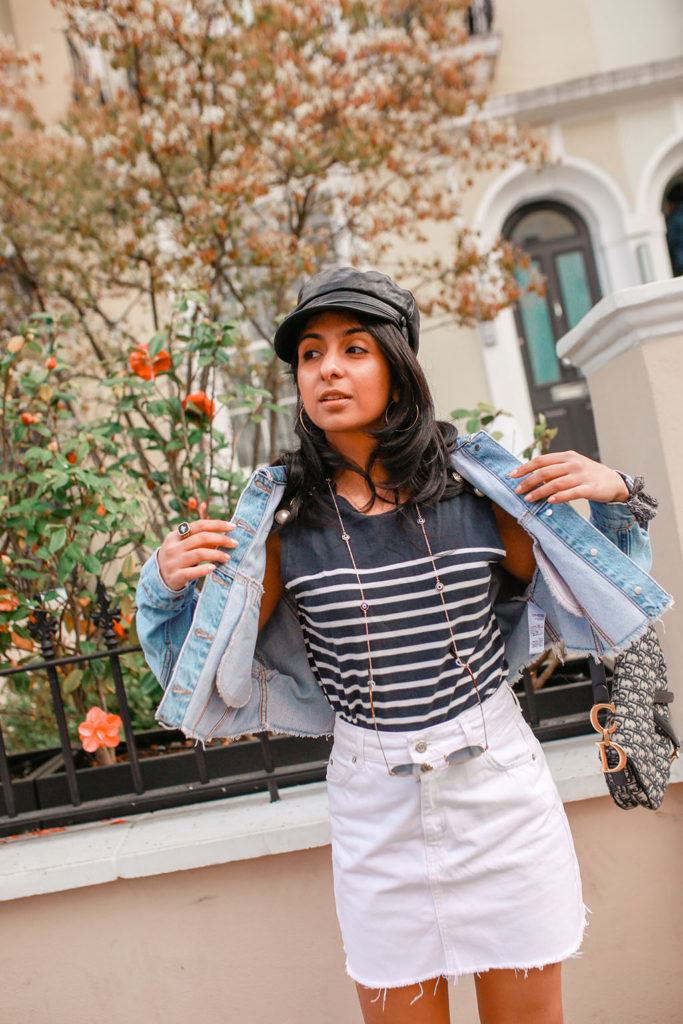 Luxury fashion blogger Shloka Narang of The Silk Sneaker shares how to wear a cropped denim jacket for the perfect summer outfit featuring Topshop, Dior and Claudie Pierlot