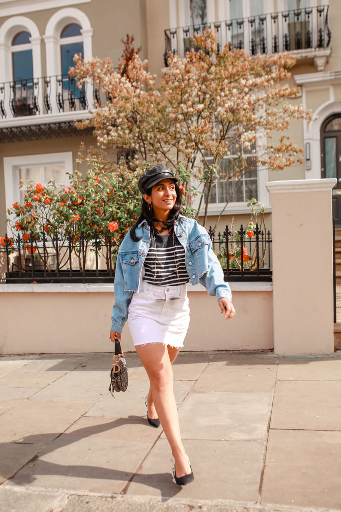 Luxury fashion blogger Shloka Narang of The Silk Sneaker shares how to wear a cropped denim jacket for the perfect summer outfit featuring Topshop, Dior and Claudie Pierlot