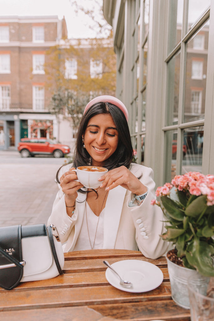 Luxury fashion blogger Shloka Narang of The Silk Sneaker shares how to style a blazer for a summer outfit featuring Sandro and Prada