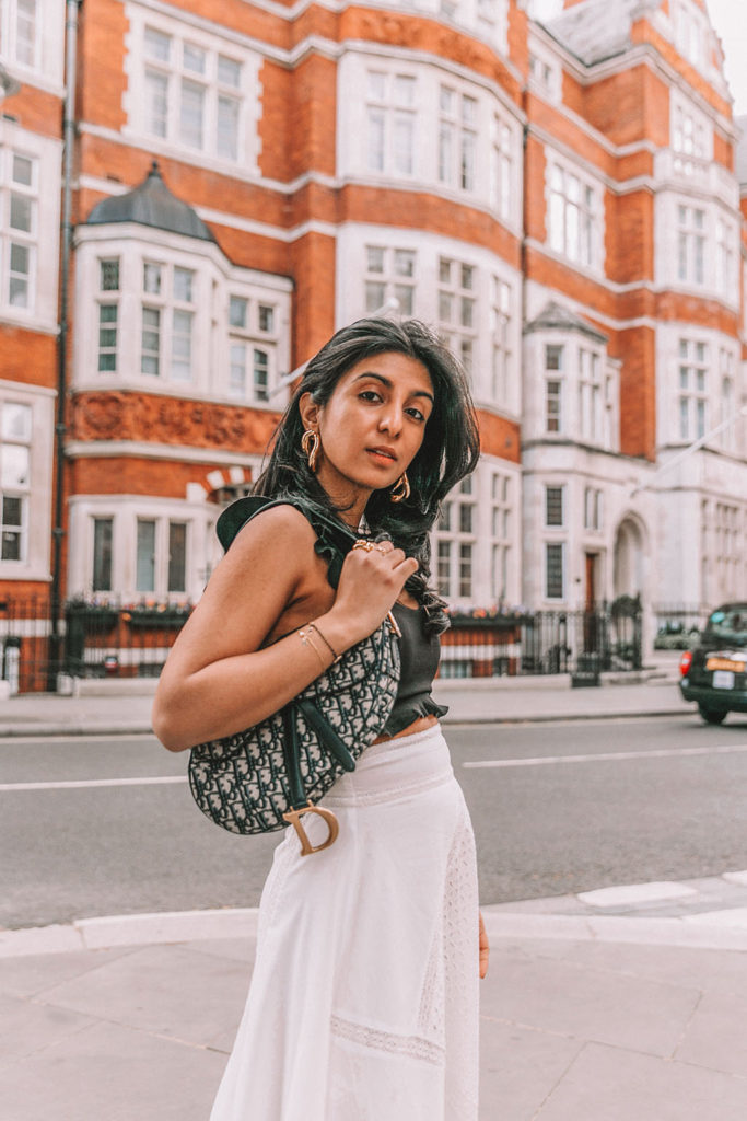 Luxury fashion blogger Shloka Narang of The Silk Sneaker shares her tips on how to style chunky summer sandals for cute and casual summer outfits featuring Prada, Dior and Topshop