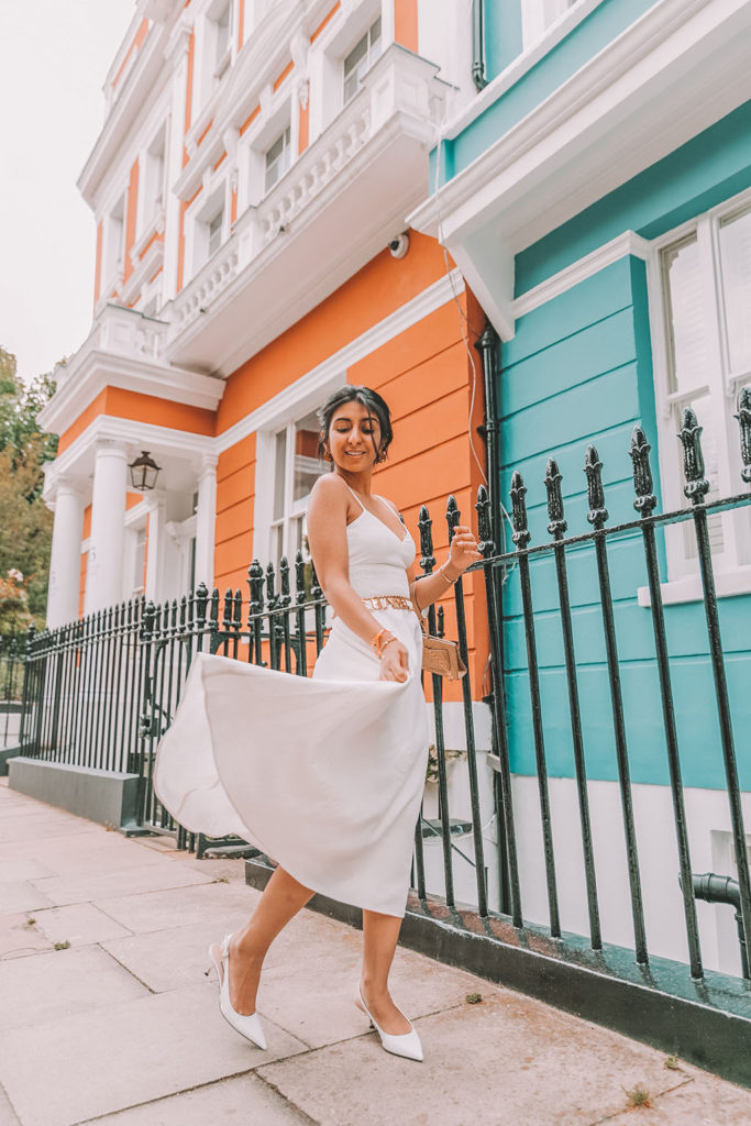 Luxury fashion blogger Shloka Narang of The Silk Sneaker shares her styling tips for wearing linen summer dresses featuring Zara, Chanel and Prada