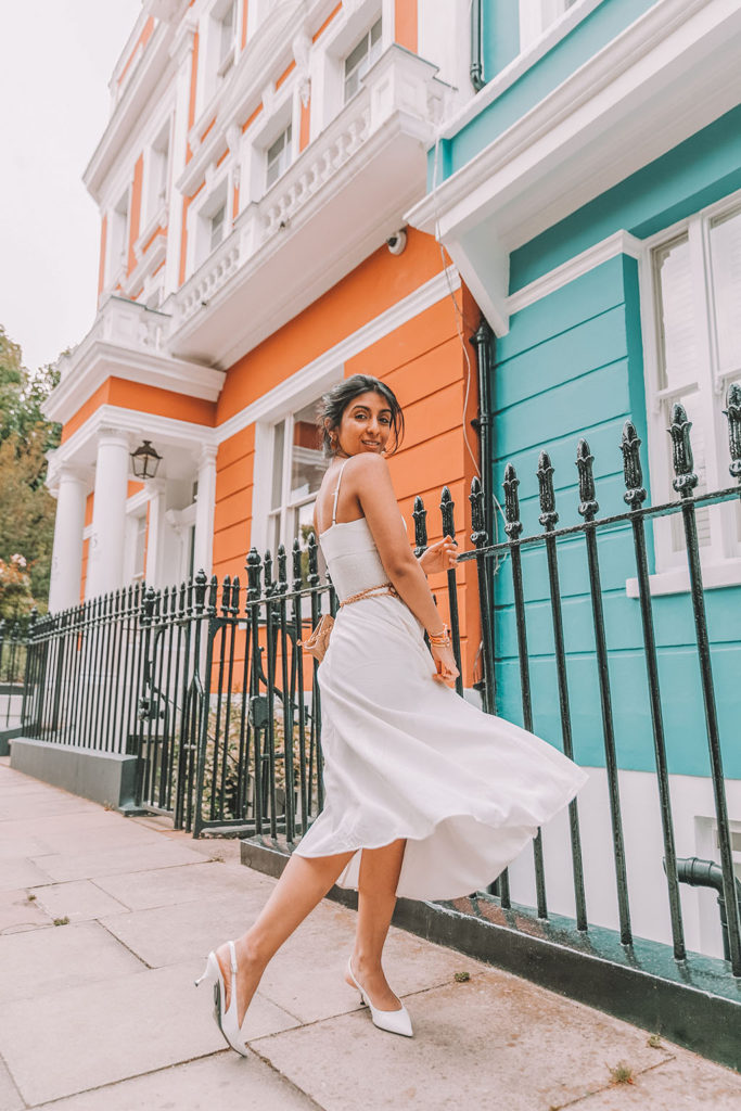 Luxury fashion blogger Shloka Narang of The Silk Sneaker shares her styling tips for wearing linen summer dresses featuring Zara, Chanel and Prada