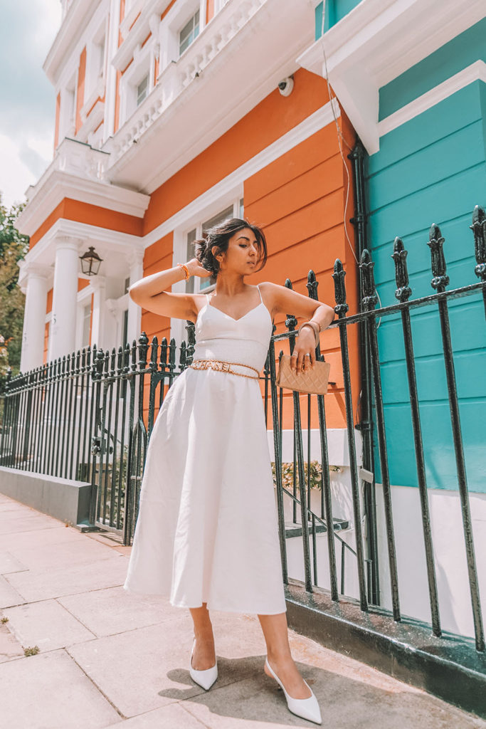 Luxury fashion blogger Shloka Narang of The Silk Sneaker shares her styling tips for wearing linen summer dresses featuring Zara, Chanel and Prada