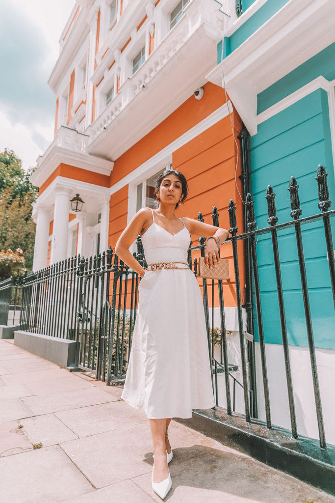 Luxury fashion blogger Shloka Narang of The Silk Sneaker shares her styling tips for wearing linen summer dresses featuring Zara, Chanel and Prada