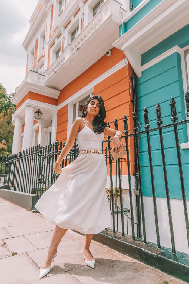 Luxury fashion blogger Shloka Narang of The Silk Sneaker shares her styling tips for wearing linen summer dresses featuring Zara, Chanel and Prada