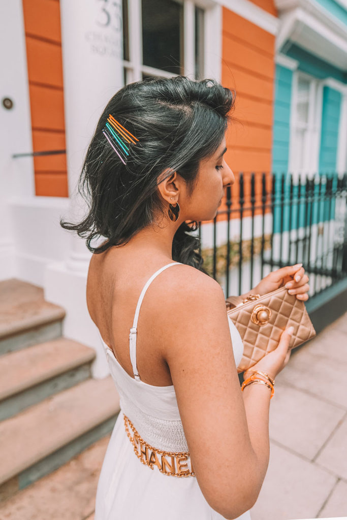 Luxury fashion blogger Shloka Narang of The Silk Sneaker shares her styling tips for wearing linen summer dresses featuring Zara, Chanel and Prada