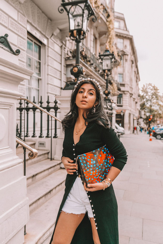Luxury fashion blogger Shloka Narang of The Silk Sneaker shares a fall outfit in a knitted dress with pearl buttons for a parisian inspired look including & Other Stories, Louis Vuitton and Topshop