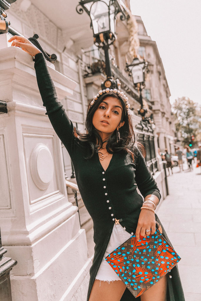 Luxury fashion blogger Shloka Narang of The Silk Sneaker shares a fall outfit in a knitted dress with pearl buttons for a parisian inspired look including & Other Stories, Louis Vuitton and Topshop