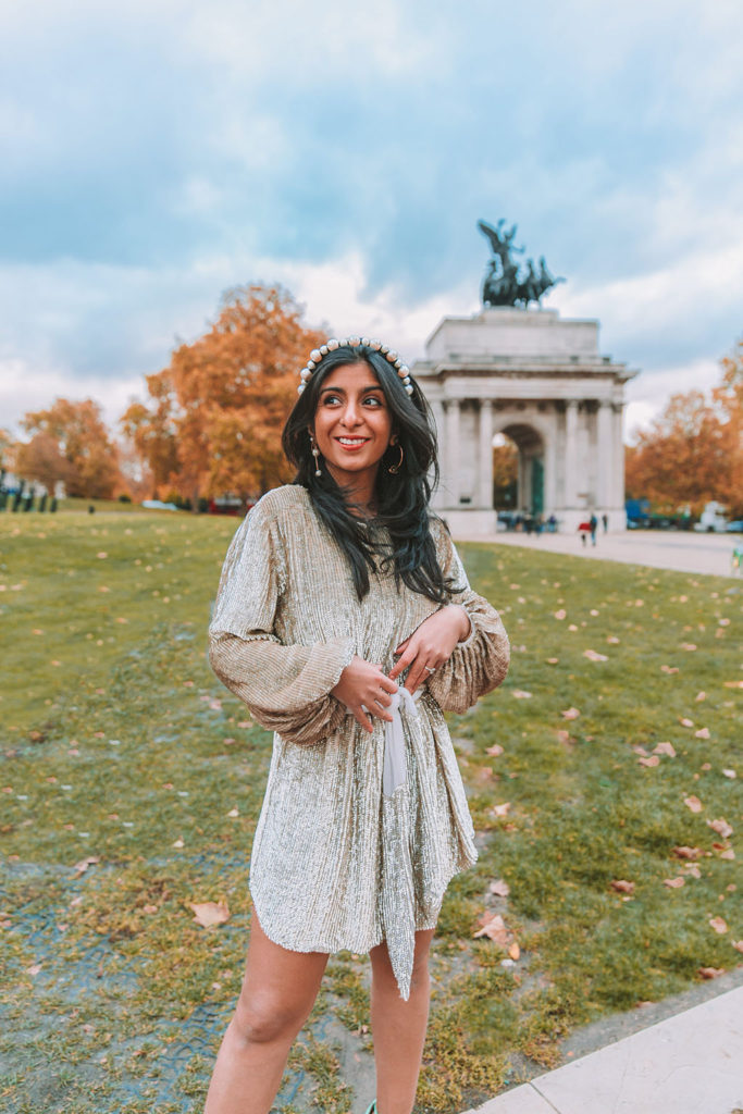 Luxury fashion blogger Shloka Narang of The Silk Sneaker shares her ultimate guide to the best christmas party dresses of 2019 and where to buy them featuring a Retrofete sequins dress