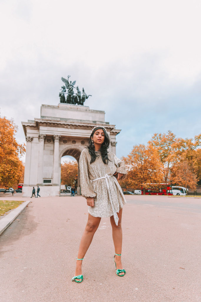 Luxury fashion blogger Shloka Narang of The Silk Sneaker shares her ultimate guide to the best christmas party dresses of 2019 and where to buy them featuring a Retrofete sequins dress