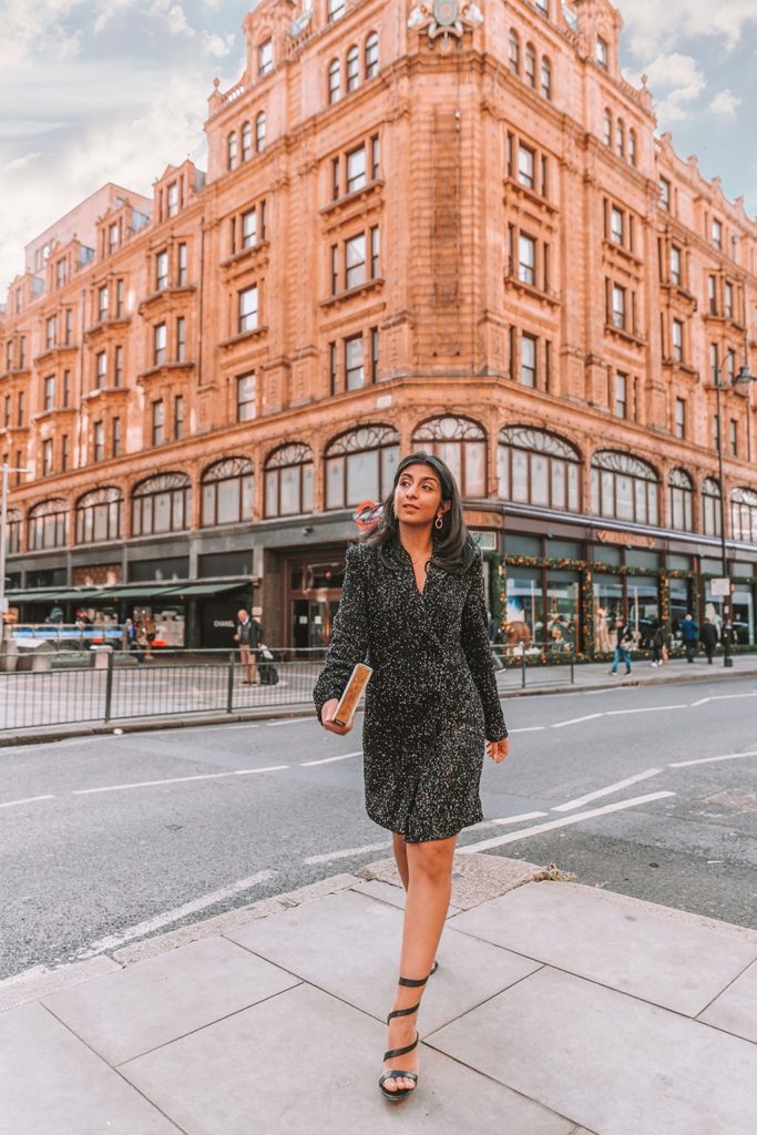 Luxury fashion blogger Shloka Narang of The Silk Sneaker shares a Christmas party and New Years Eve outfit while styling a sequins blazer dress from & Other Stories and Gianvito Rossi Heels outside Harrods