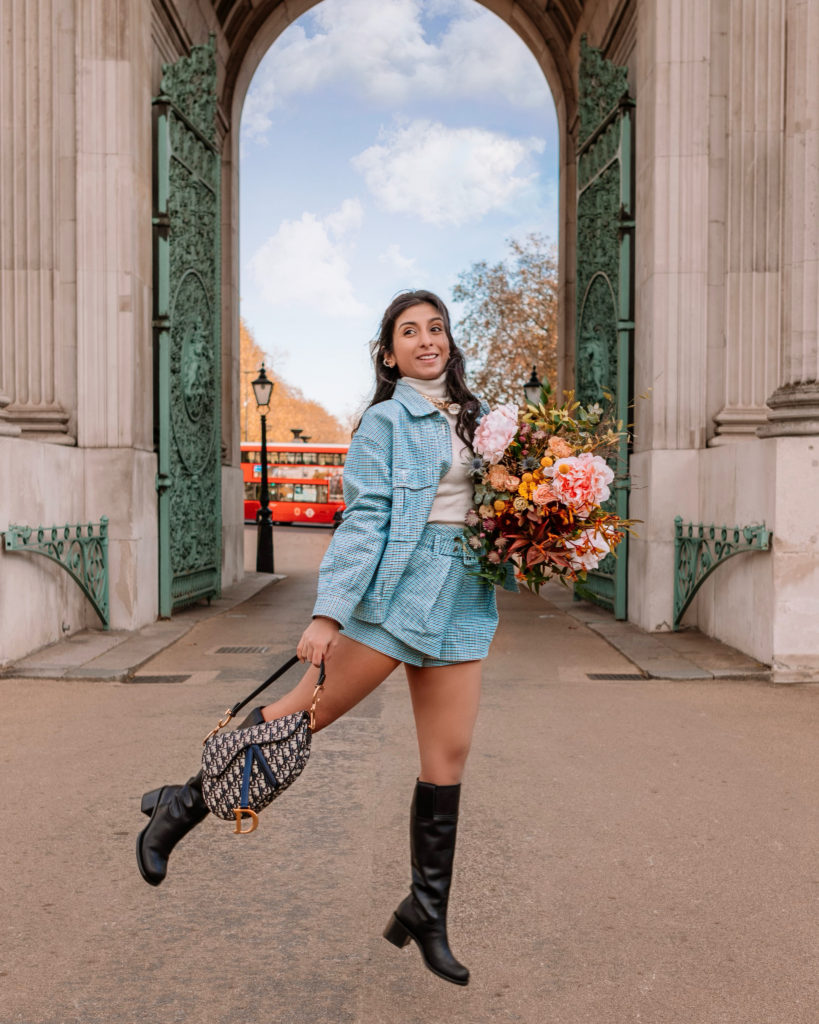 London Fashion blogger Shloka Narang of The Silk Sneaker shares a fall winter outfit with knee high Miu Miu boots