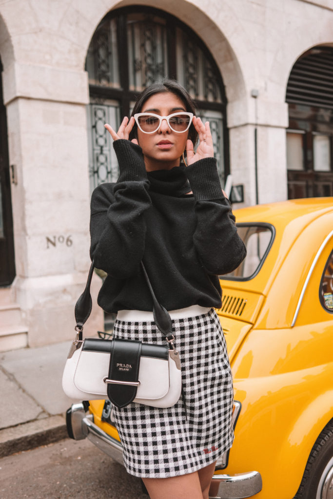 Fashion blogger Shloka of The Silk Sneaker shares her style icon Audrey Hepburn with Farfetch wearing Miu Miu and Prada