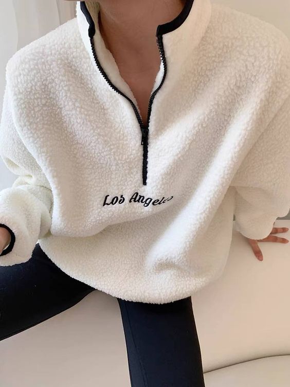 Luxury fashion blogger Shloka Sensarma of The Silk Sneaker shares how to style a fleece pullover for a winter and spring everyday outfit